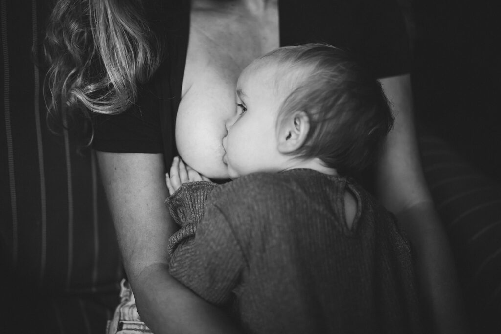 Baby breastfeeding during motherhood session in Bremerton, WA