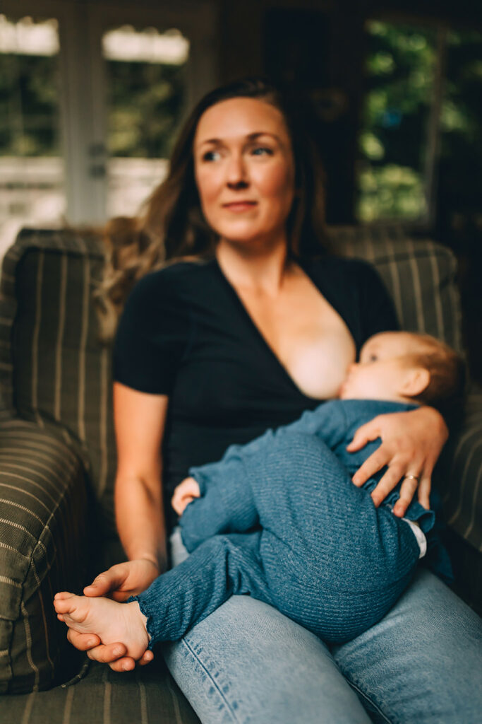 Baby breastfeeding during motherhood session in Bremerton, WA