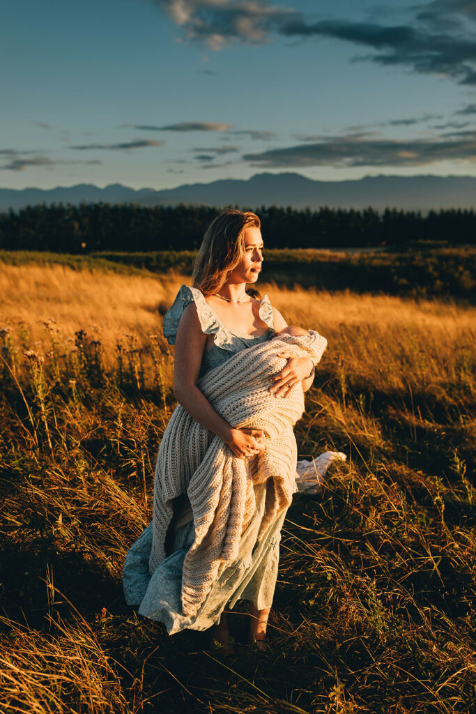 Mother holding baby during motherhood session in Sequim, WA