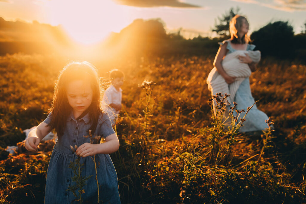 Mother and children in a field for photoshoot
