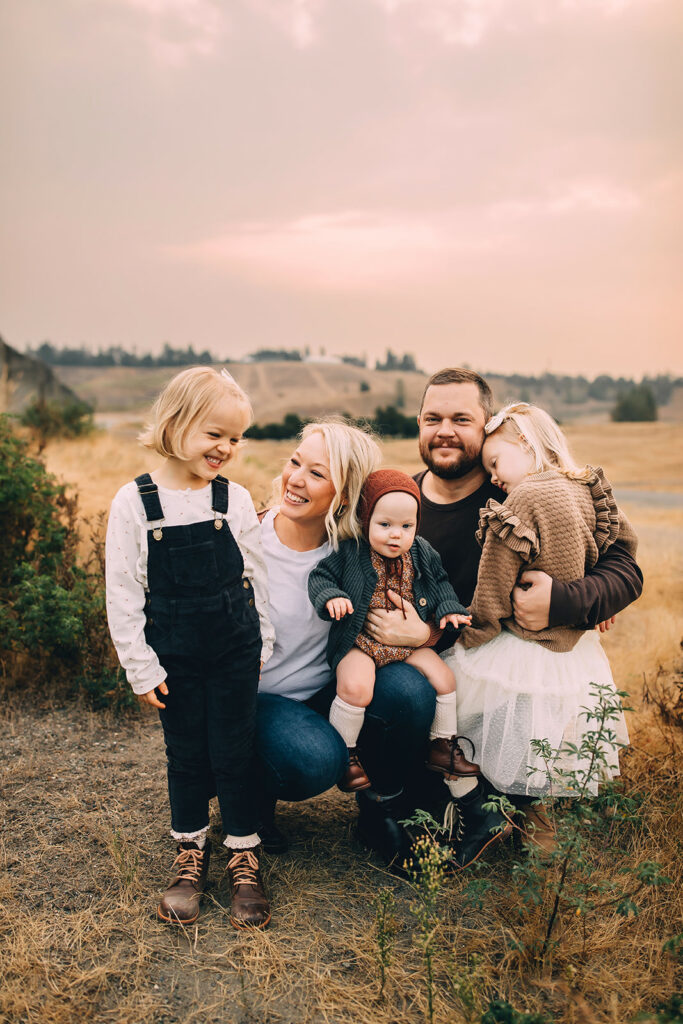 Family of five posing for fall family photos in Tacoma Washington USA
