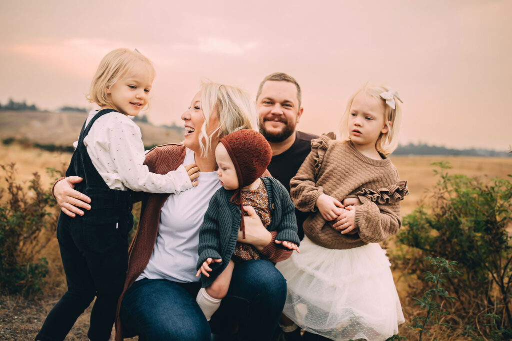 Family of five posing for fall family photos in Tacoma Washington USA