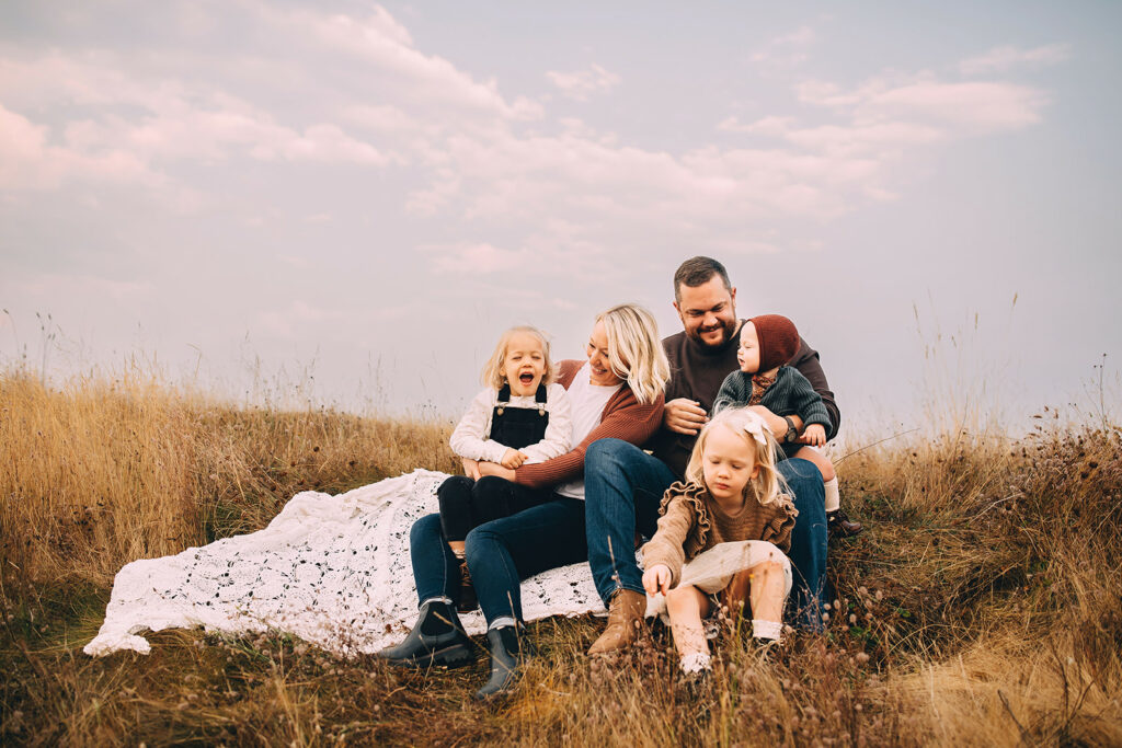 Family of five posing for family photos in Tacoma Washington USA