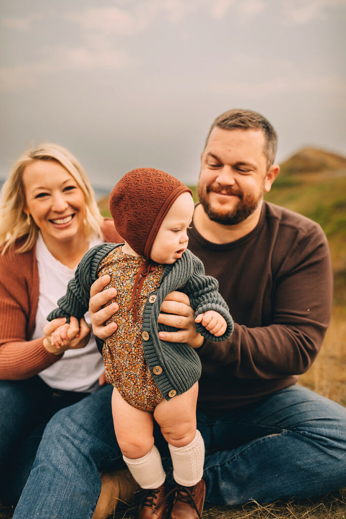 Couple posing with their baby during family photoshoot