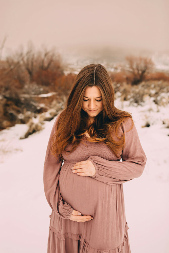 Woman holding her belly for photoshoot